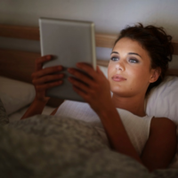 woman reading in bed